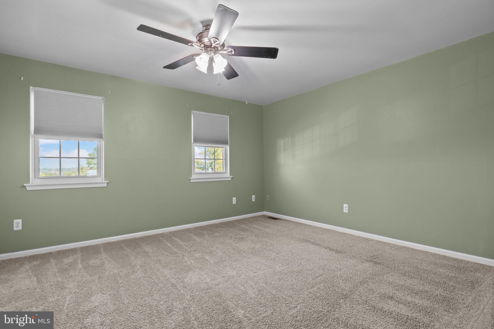 1006 North York Road, Unit 1 Willow Grove, PA 19090 - Photo 22 of 26 an empty room with a window and a fan