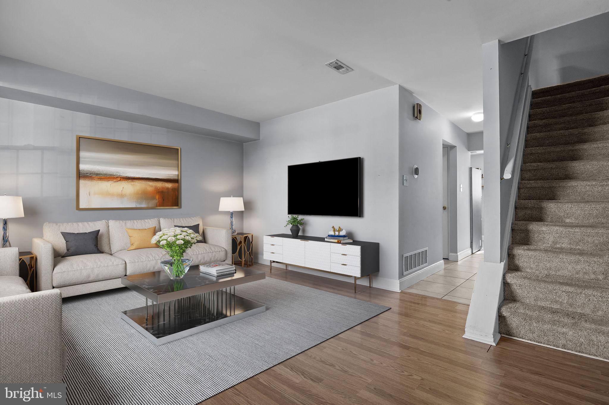 1006 North York Road, Unit 1 Willow Grove, PA 19090 - Photo 4 of 26 a living room with furniture and a flat screen tv