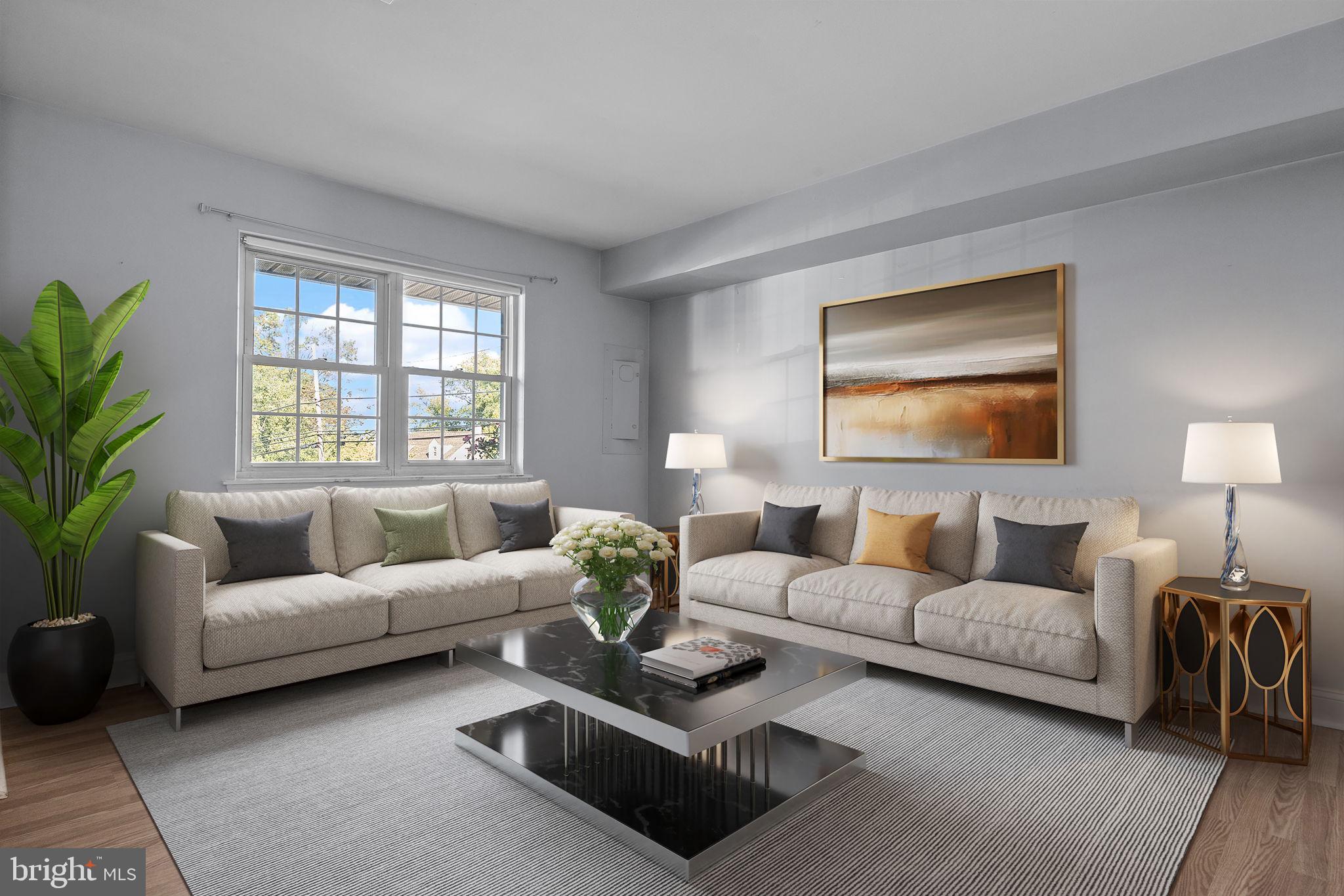 1006 North York Road, Unit 1 Willow Grove, PA 19090 - Photo 5 of 26 a living room with furniture and a large window