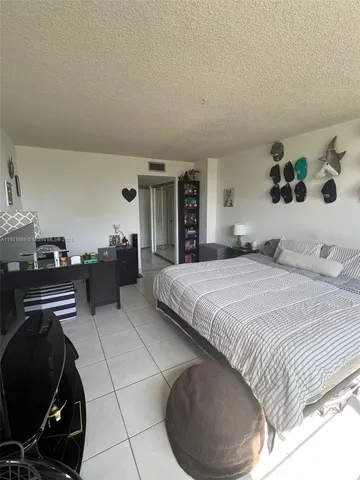 a bedroom with a bed and a cabinets