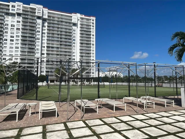 a view of a patio with a table and chairs