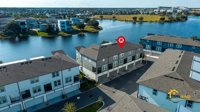 an aerial view of houses with yard
