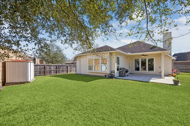 a view of a garage with storage and a white door