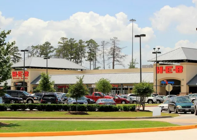 a city street lined with buildings and trees