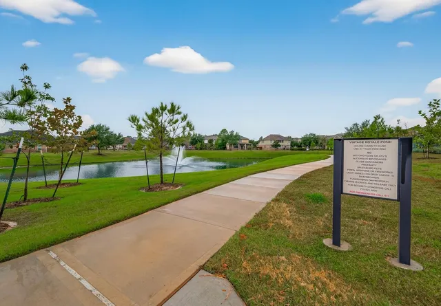 a view of a patio with a table chairs and a fire pit