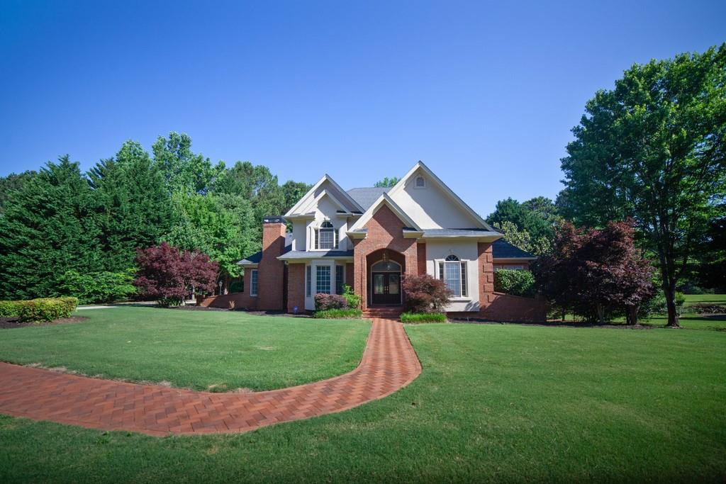 a front view of a house with a yard