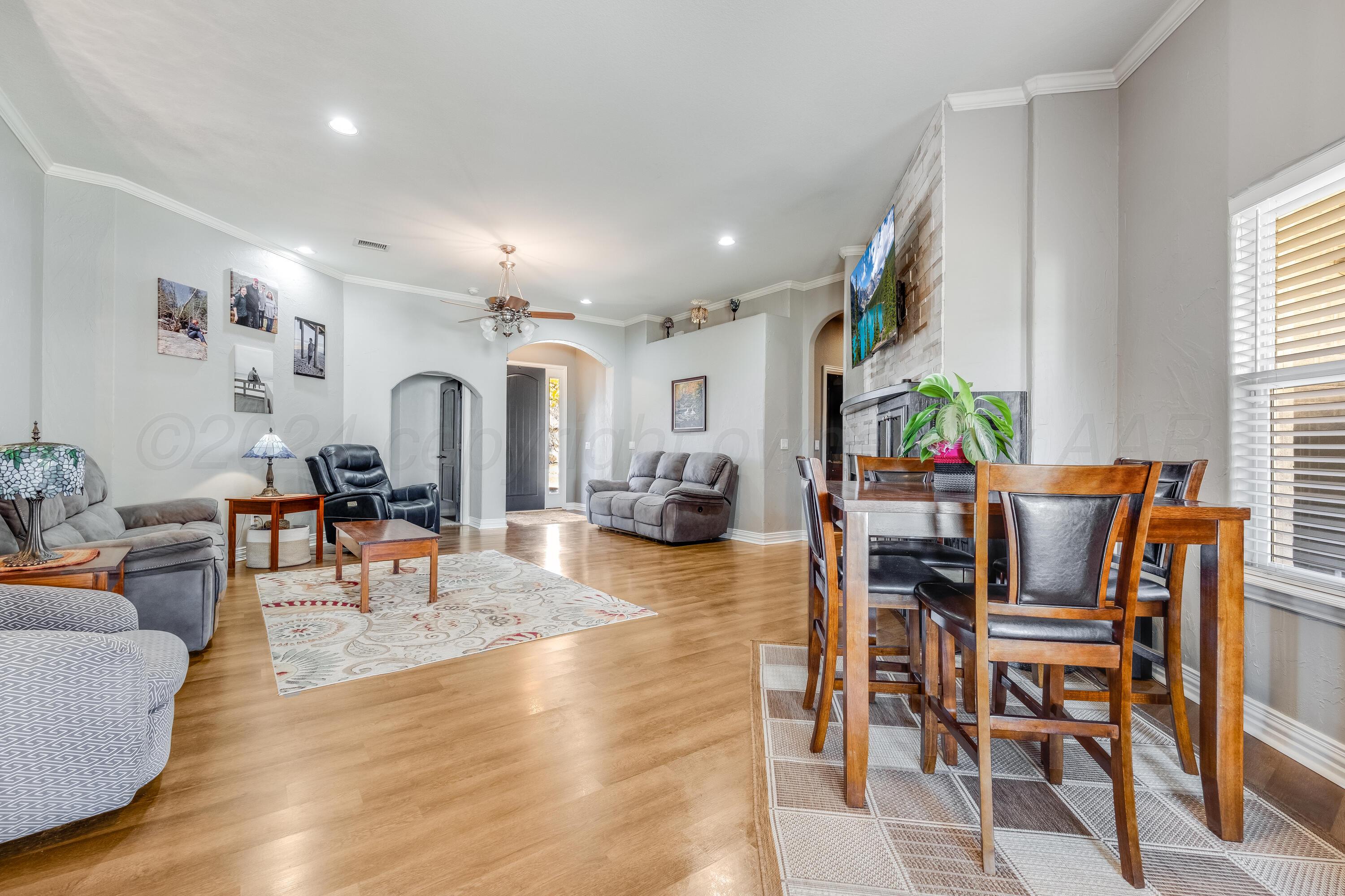 8413 Hamilton Drive Amarillo, TX 79119 - Photo 16 of 54 a living room with furniture and a large window