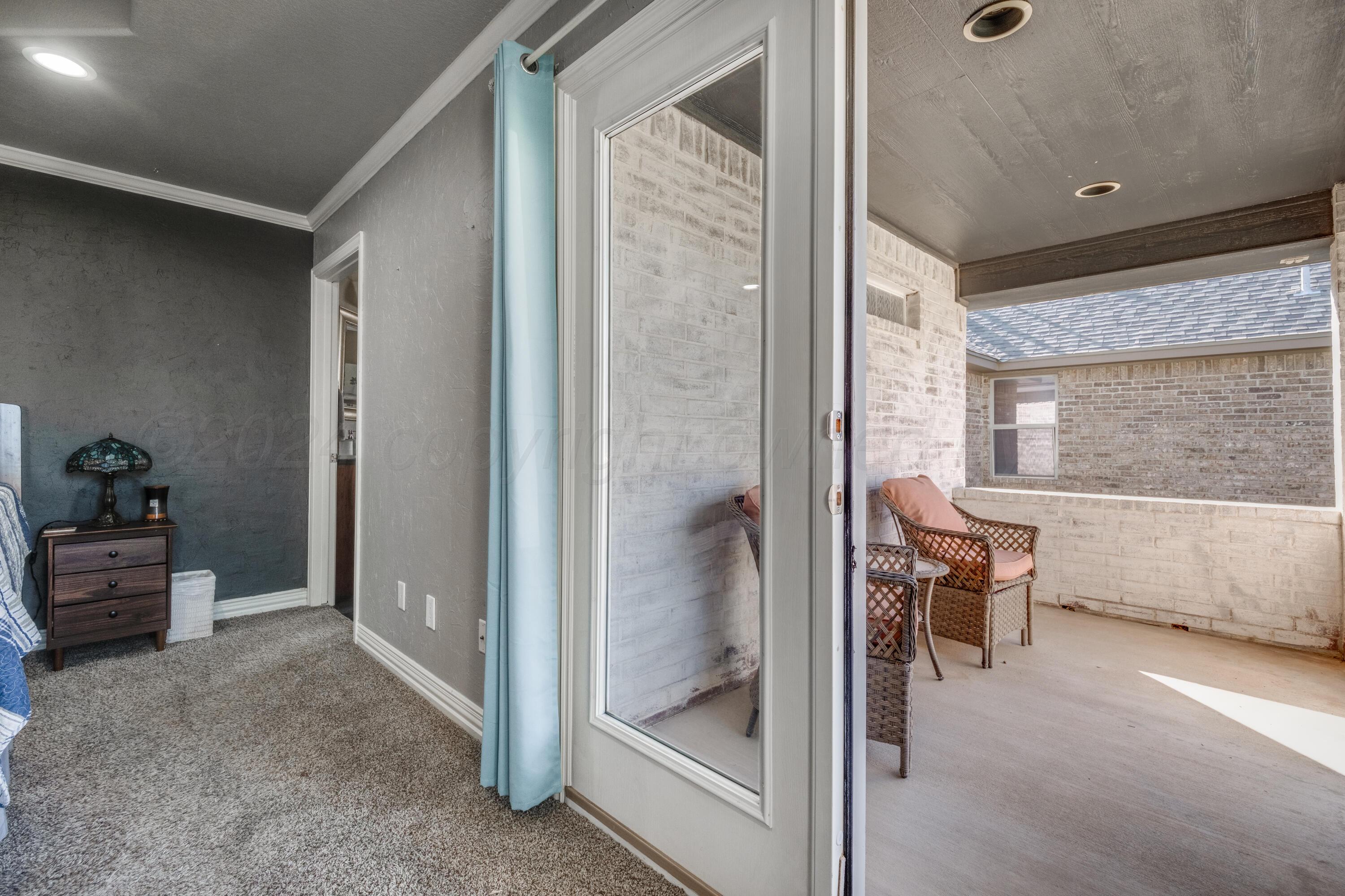 8413 Hamilton Drive Amarillo, TX 79119 - Photo 20 of 54 a view of a hallway with furniture and windows