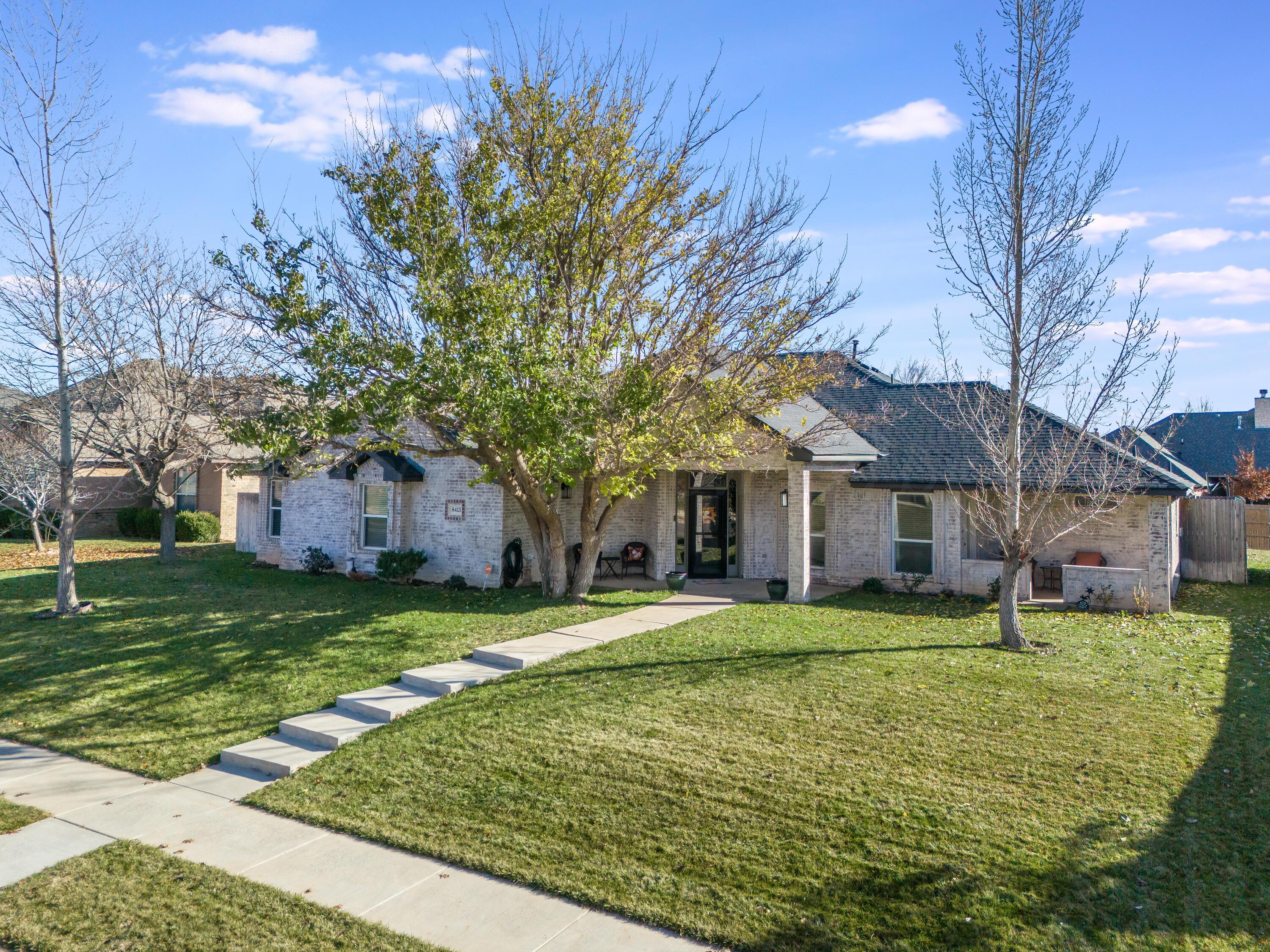 8413 Hamilton Drive Amarillo, TX 79119 - Photo 3 of 54 a view of a house with a yard