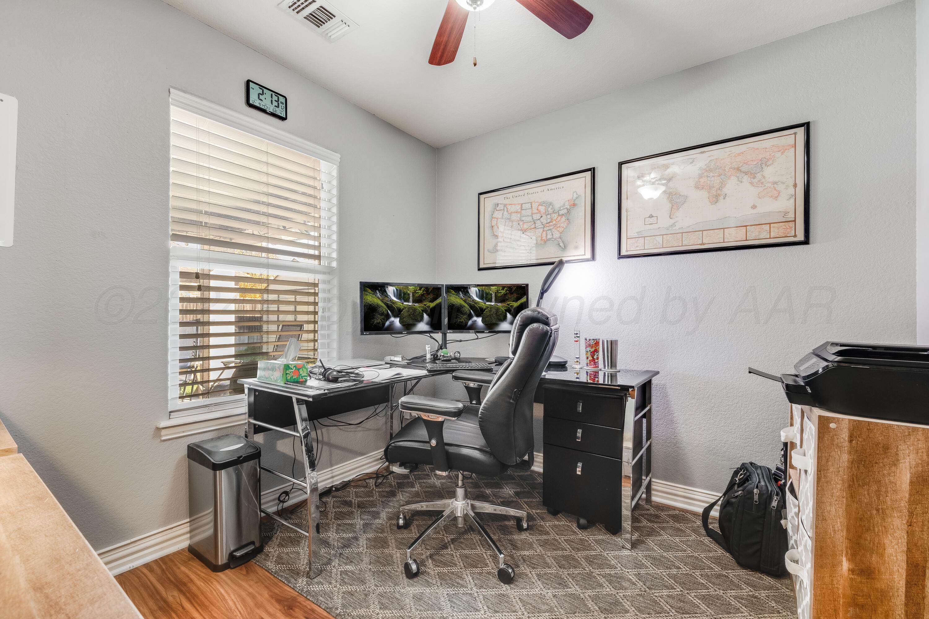 8413 Hamilton Drive Amarillo, TX 79119 - Photo 40 of 54 a view of a workspace with furniture and a window