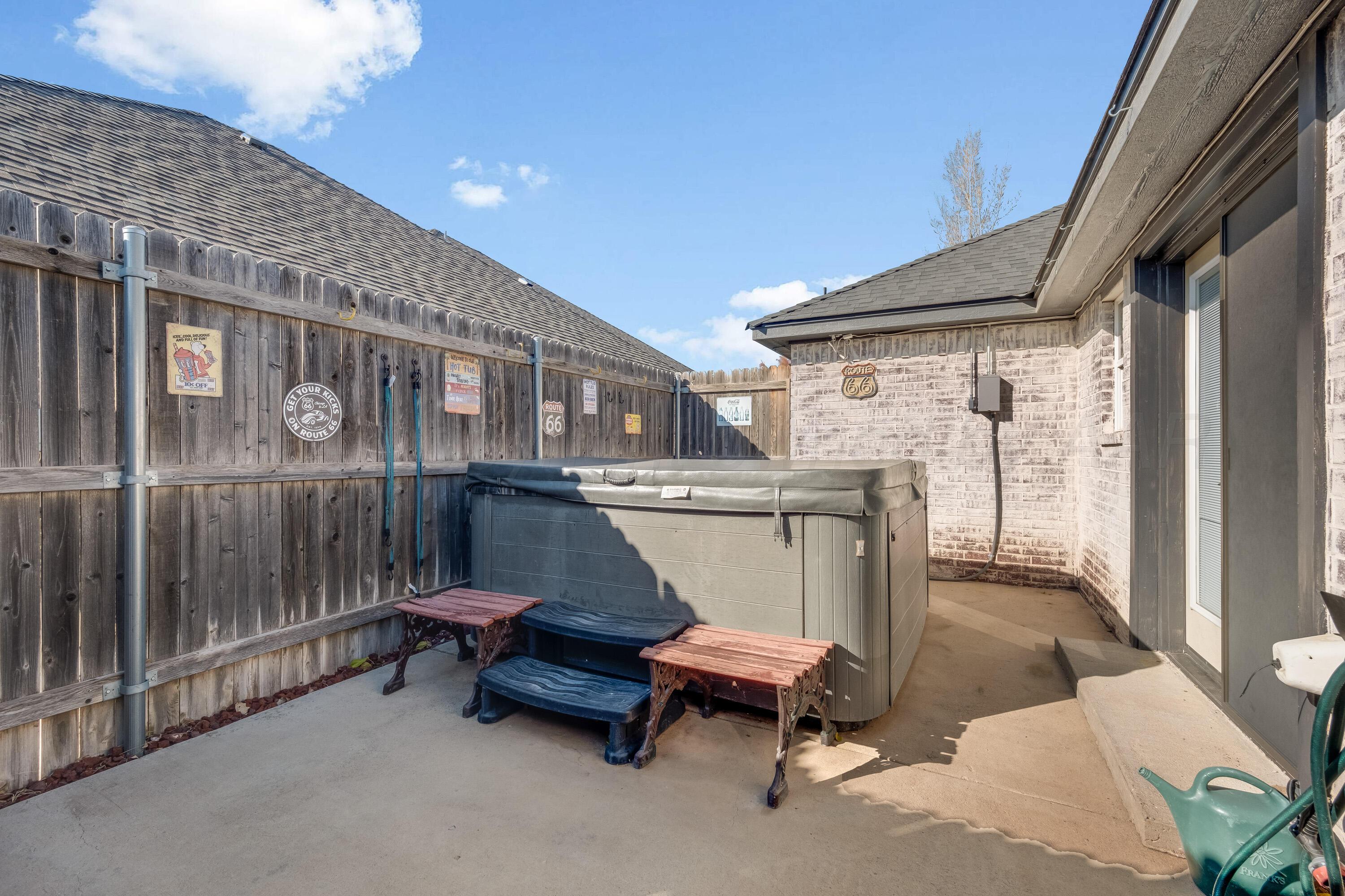 8413 Hamilton Drive Amarillo, TX 79119 - Photo 42 of 54 a backyard of a house with barbeque oven table and chairs