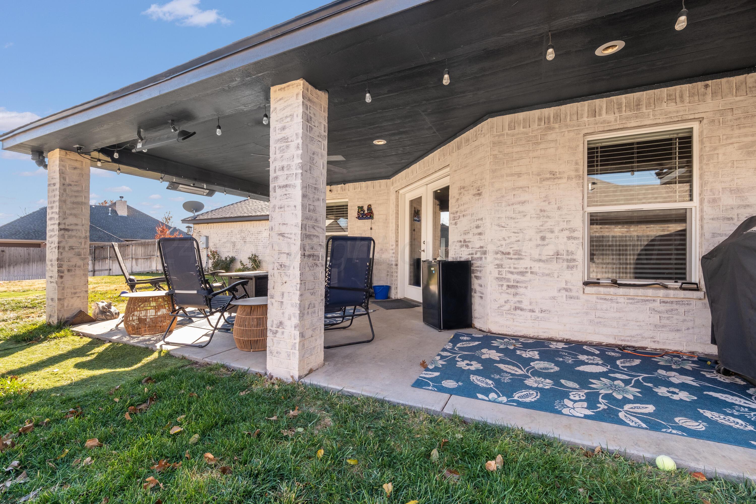 8413 Hamilton Drive Amarillo, TX 79119 - Photo 44 of 54 a view of a porch with chairs and backyard