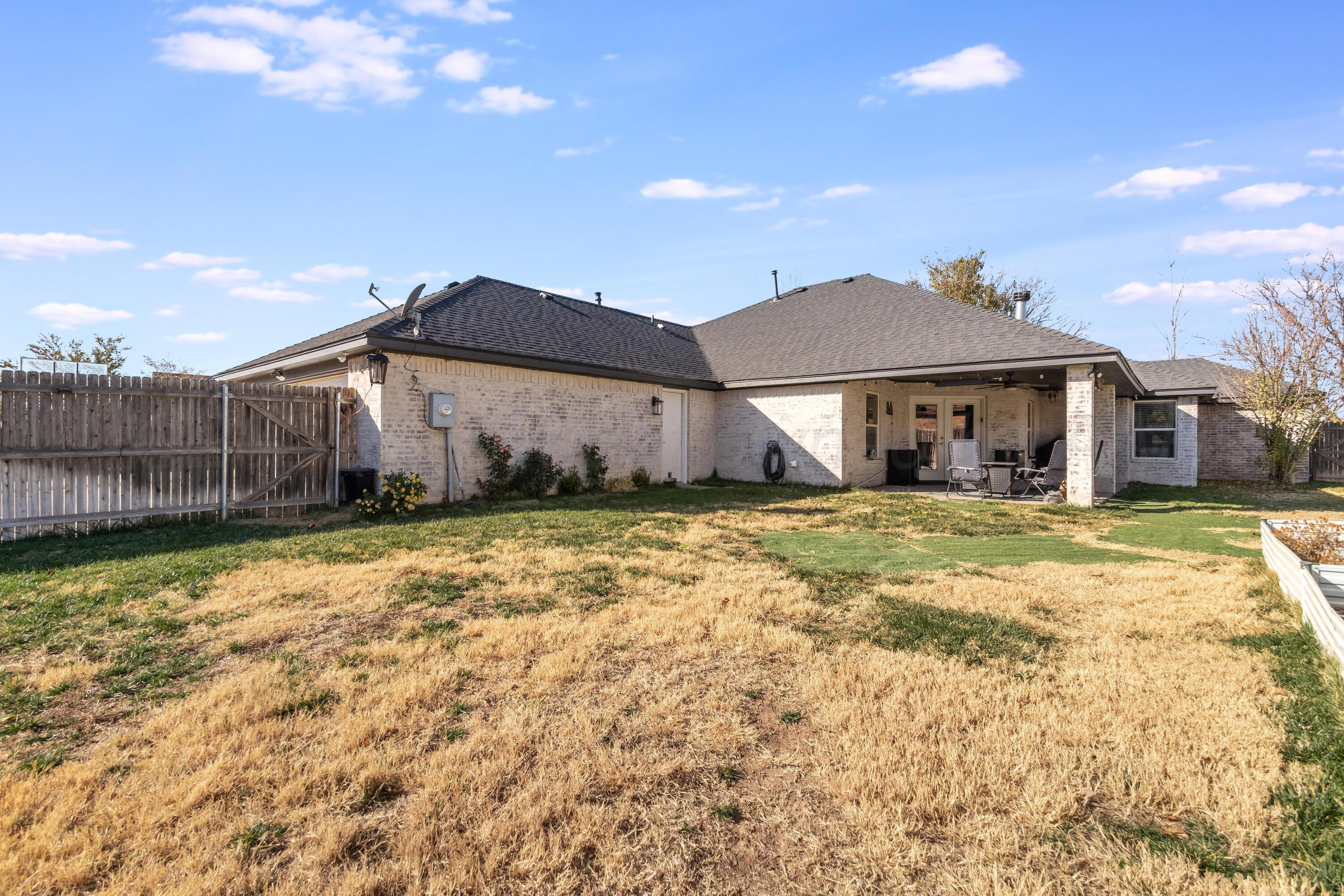 8413 Hamilton Drive Amarillo, TX 79119 - Photo 47 of 54 a front view of a house with a yard