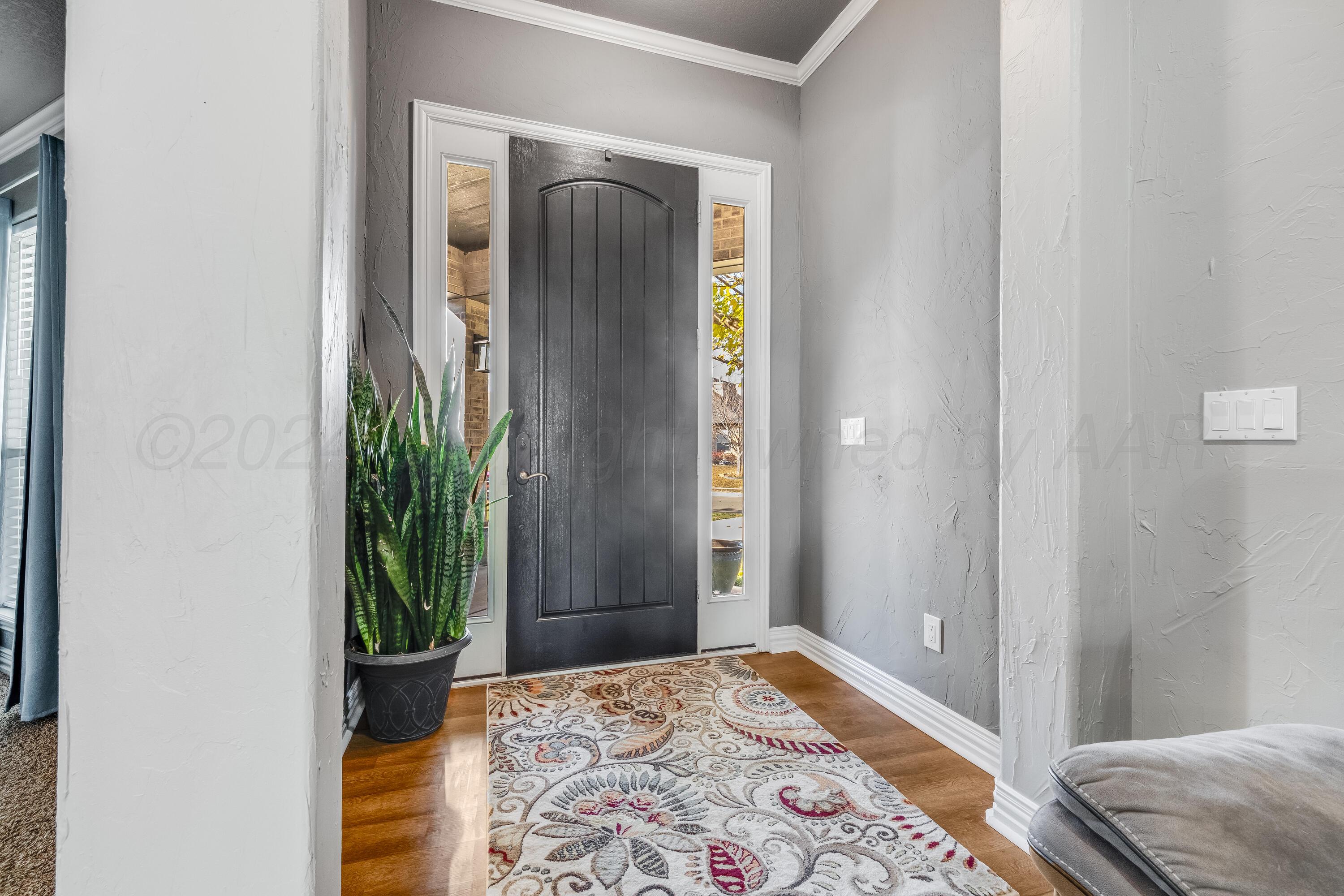 8413 Hamilton Drive Amarillo, TX 79119 - Photo 5 of 54 a bedroom with a bed and a potted plant