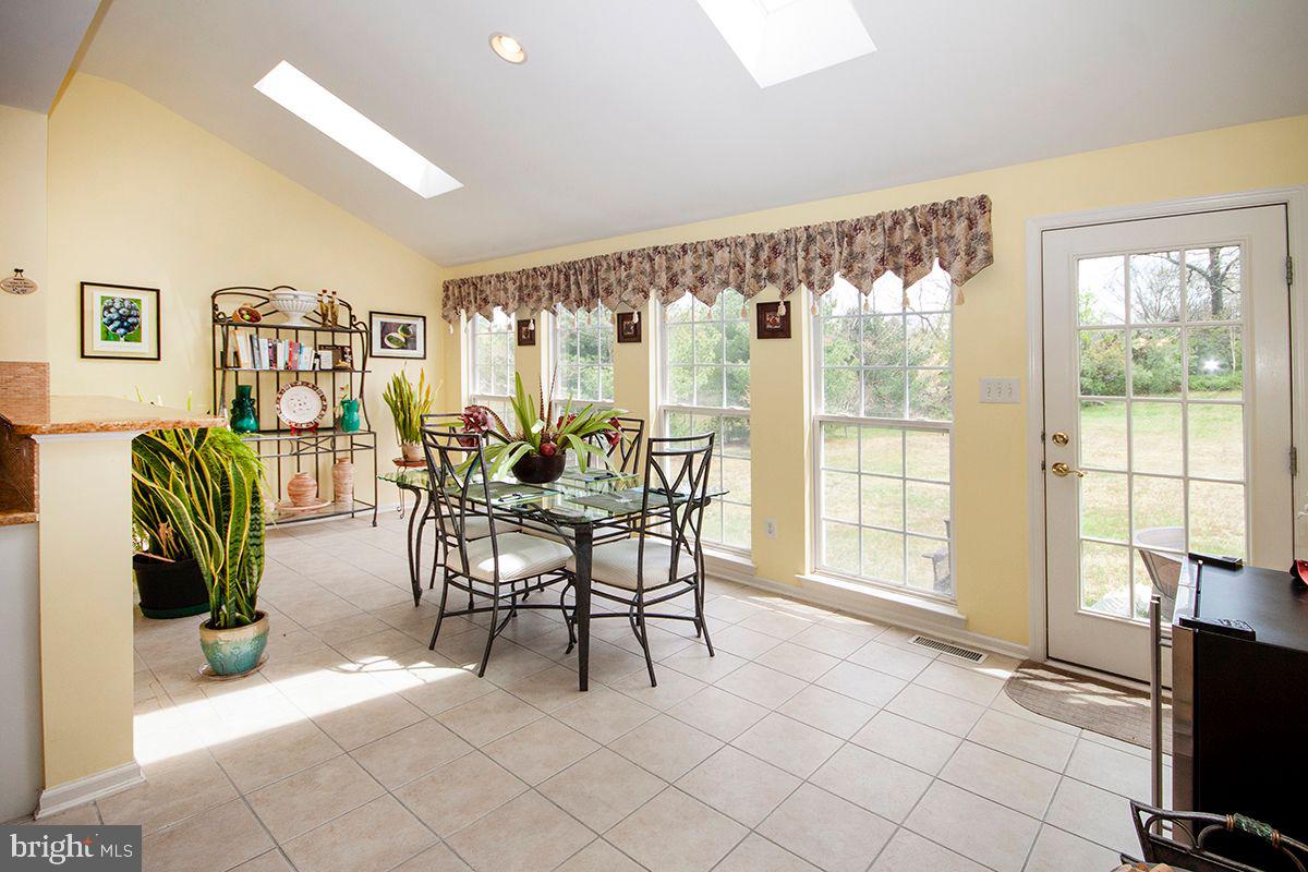 39 Red Fox Trail Sicklerville, NJ 08081 - Photo 11 of 44 Sunroom: Ceramic Tile Floors, Skylights