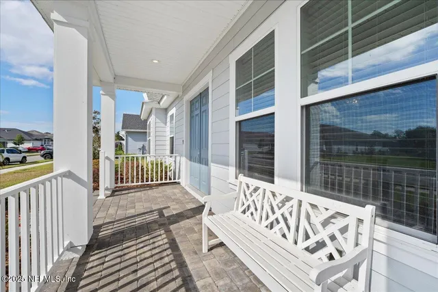 a view of a porch with a bench