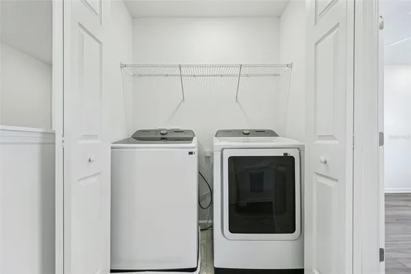 a utility room with dryer and washer
