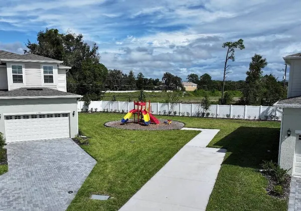 a view of a garden and swimming pool
