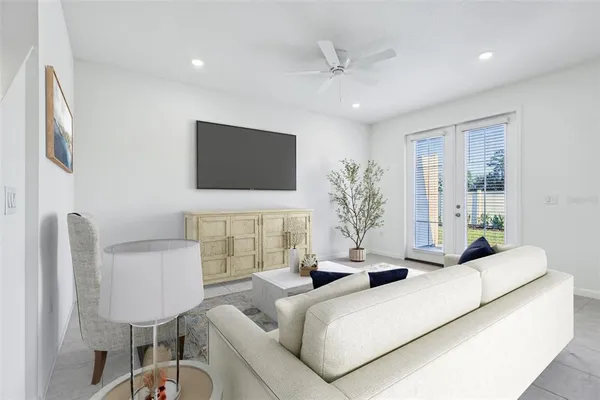 a living room with furniture and a flat screen tv