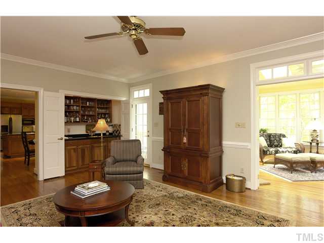 10028 Old Warden Road Raleigh, NC 27615 - Photo 8 of 25 a living room with furniture and a wooden floor