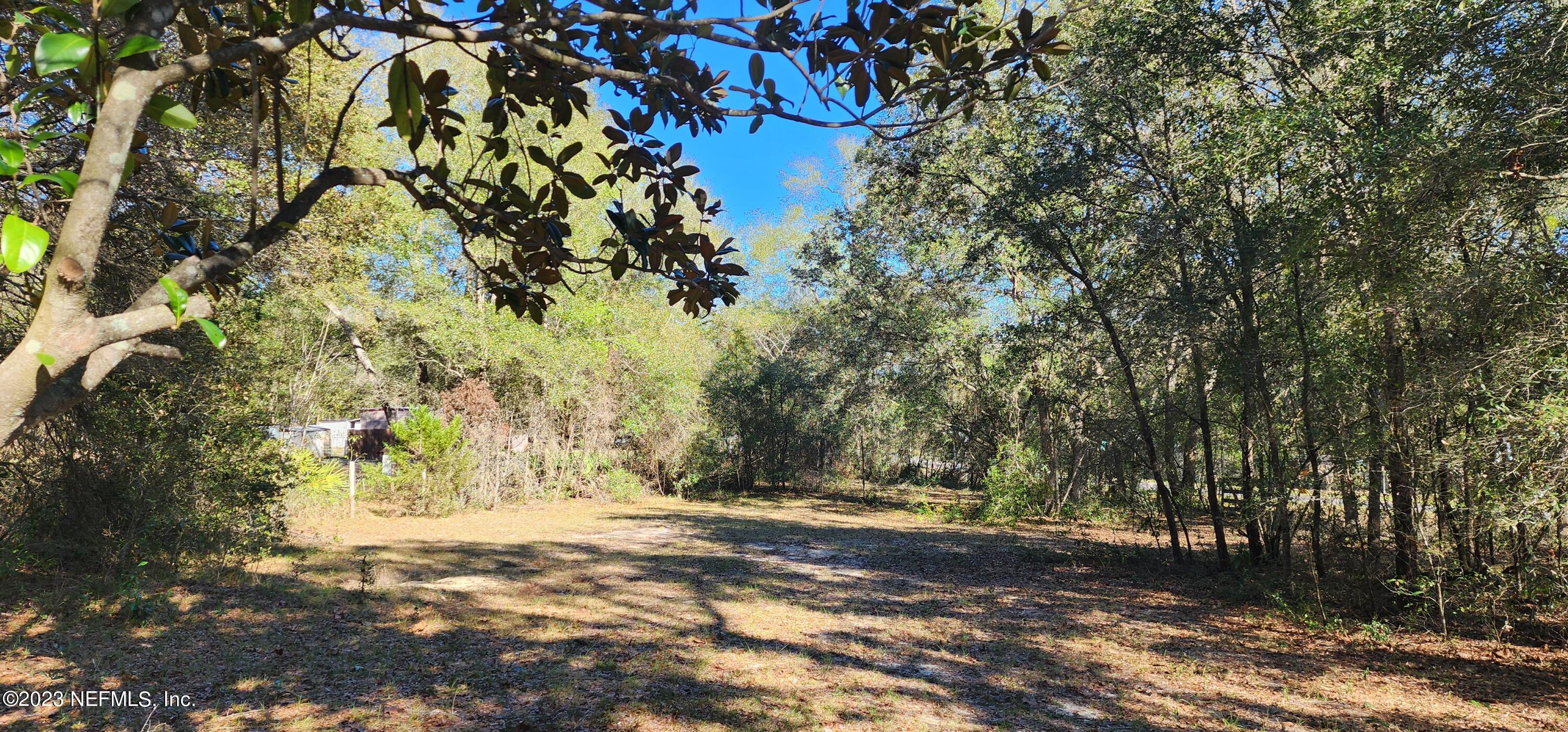 8274 Swan Lake Road Melrose, FL 32666 - Photo 12 of 18 Facing Home to gate