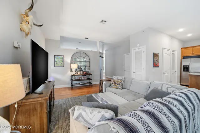 a living room with furniture fireplace and a flat screen tv