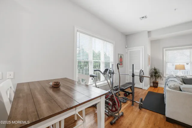 a view of a livingroom with furniture and a window