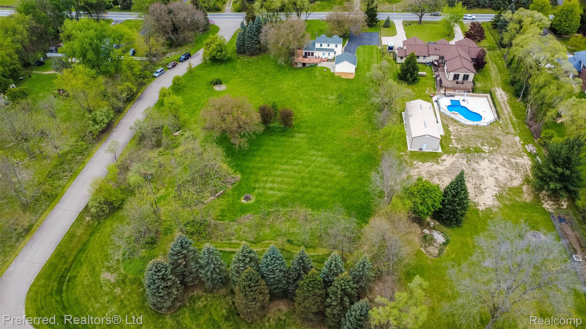 9840 Currie Road Northville, MI 48167 - Photo 58 of 62 Bird's eye view of a pool area