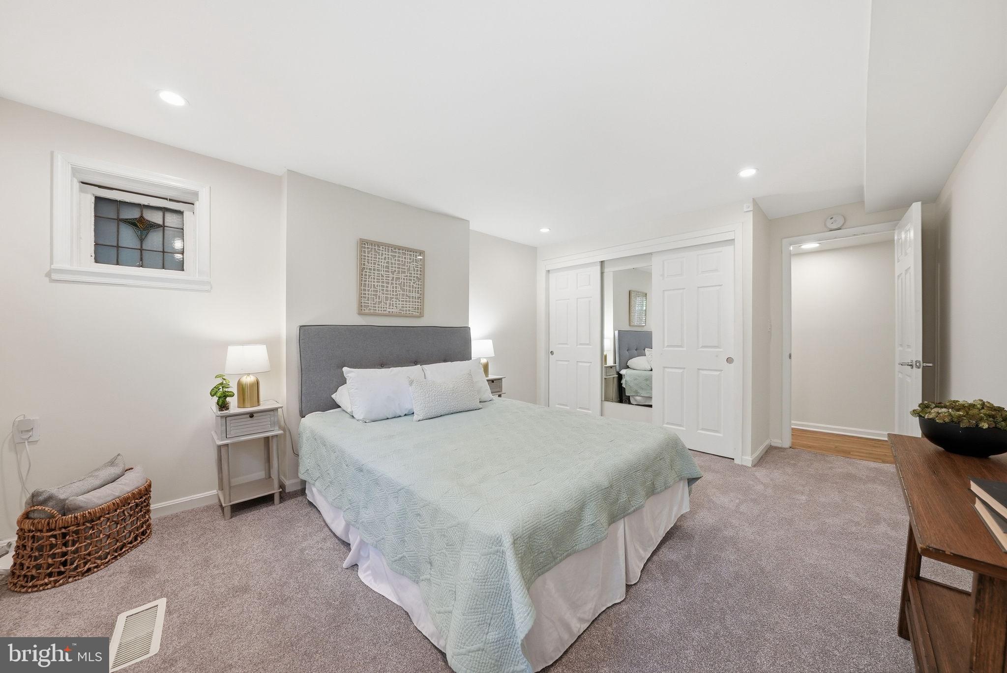 1200 East Capitol Street Northeast, Unit 1 Washington, DC 20002 - Photo 22 of 31 a spacious bedroom with a bed and a couch