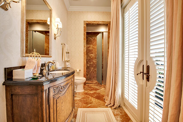 17791 Saxony Court Boca Raton, FL 33496 - Photo 18 of 41 a bathroom with a sink a mirror and a shower