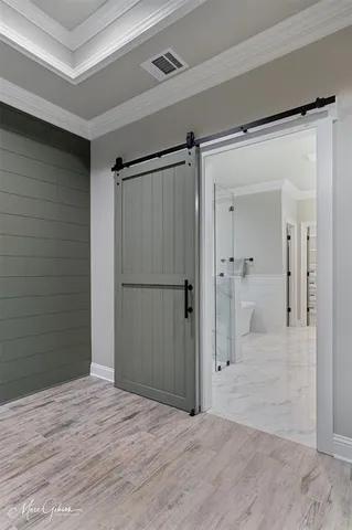 a view of a bathroom with a walk in closet