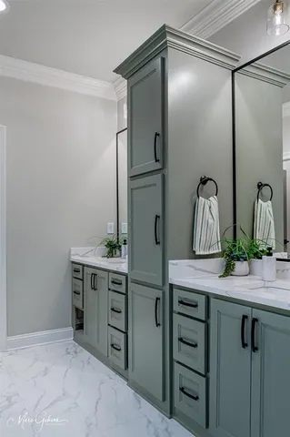 a kitchen with a sink and cabinets