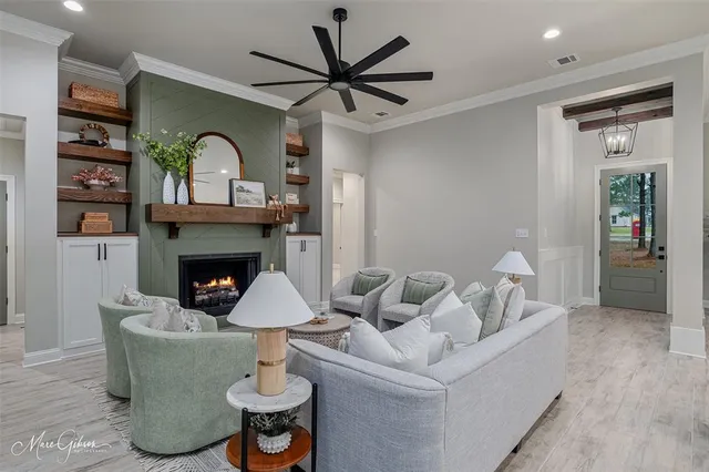 a living room with furniture and a fireplace