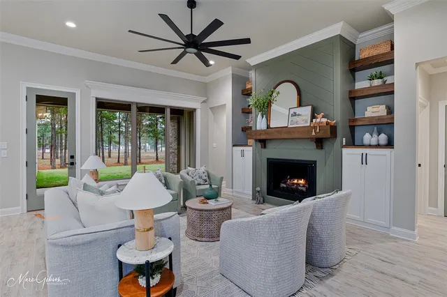 a living room with furniture and a fireplace