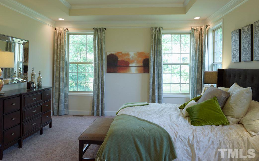 7414 Randshire Way Raleigh, NC 27616 - Photo 13 of 25 a bedroom with a bed and window