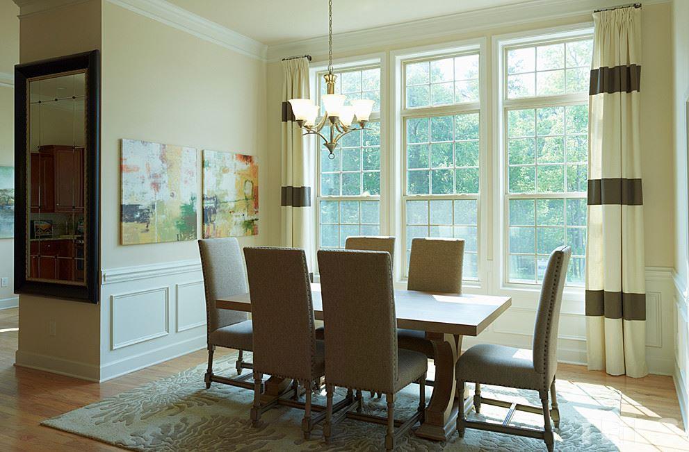 7414 Randshire Way Raleigh, NC 27616 - Photo 6 of 25 a view of a dining room with furniture window and wooden floor