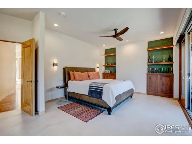 a bedroom with a bed and a cabinets