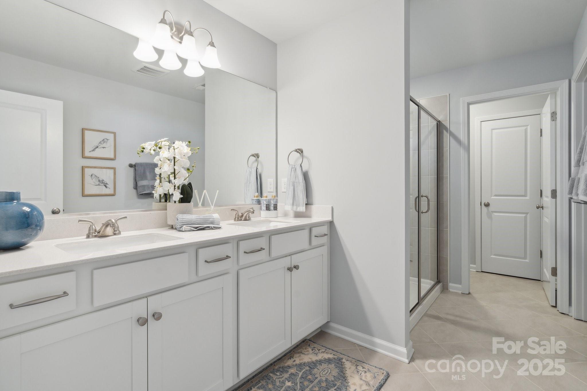940 Leyna Court Newton, NC 28658 - Photo 8 of 8 a bathroom with a double vanity sink mirror and shower