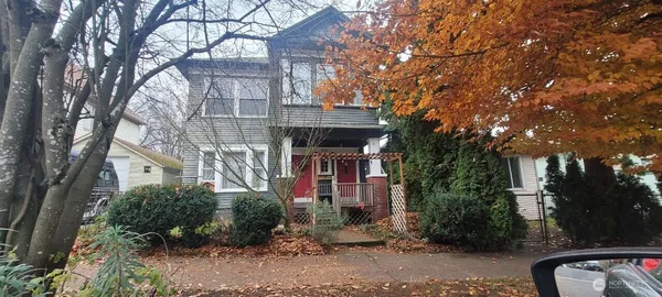 a front view of a house with parking area