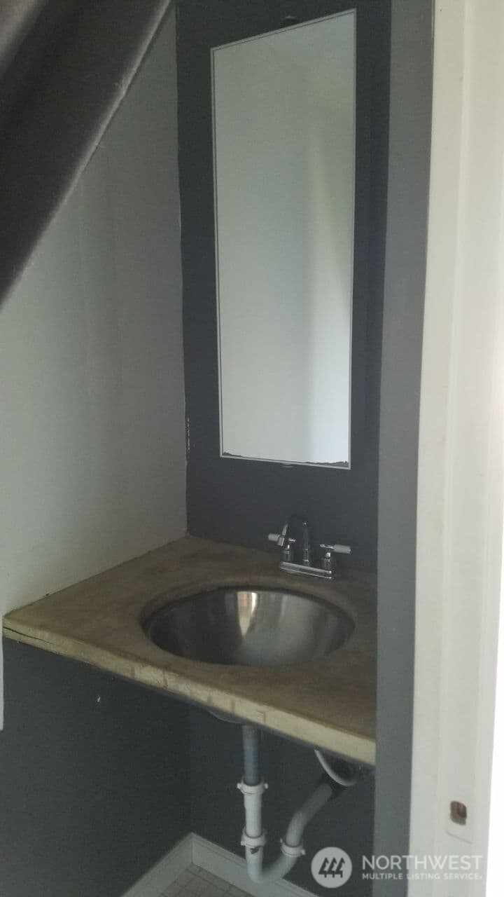 722 20th Avenue Seattle, WA 98122 - Photo 16 of 21 a bathroom with a sink and mirror