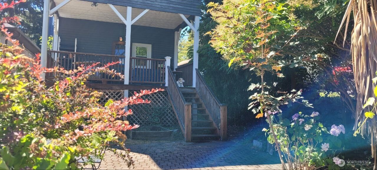 722 20th Avenue Seattle, WA 98122 - Photo 17 of 21 a front view of a house with a yard and flowers