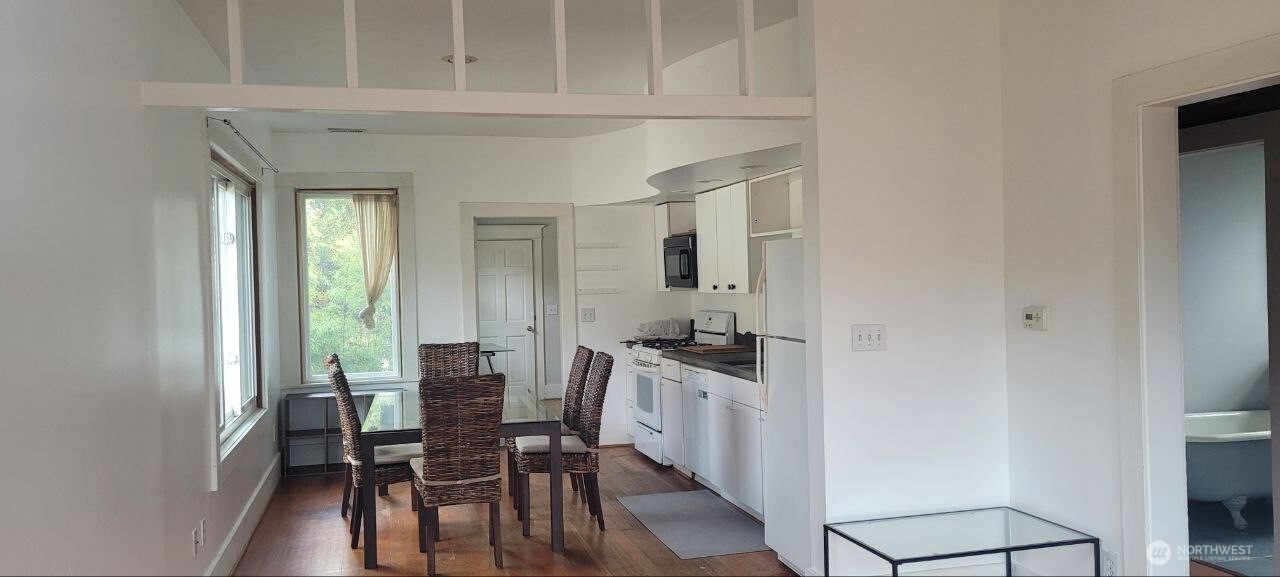 722 20th Avenue Seattle, WA 98122 - Photo 3 of 21 a view of a dining room with furniture and wooden floor