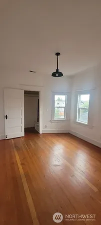 a view of an empty room with a window