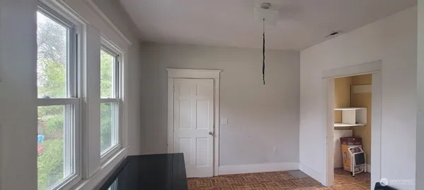 a view of hallway with window and entryway