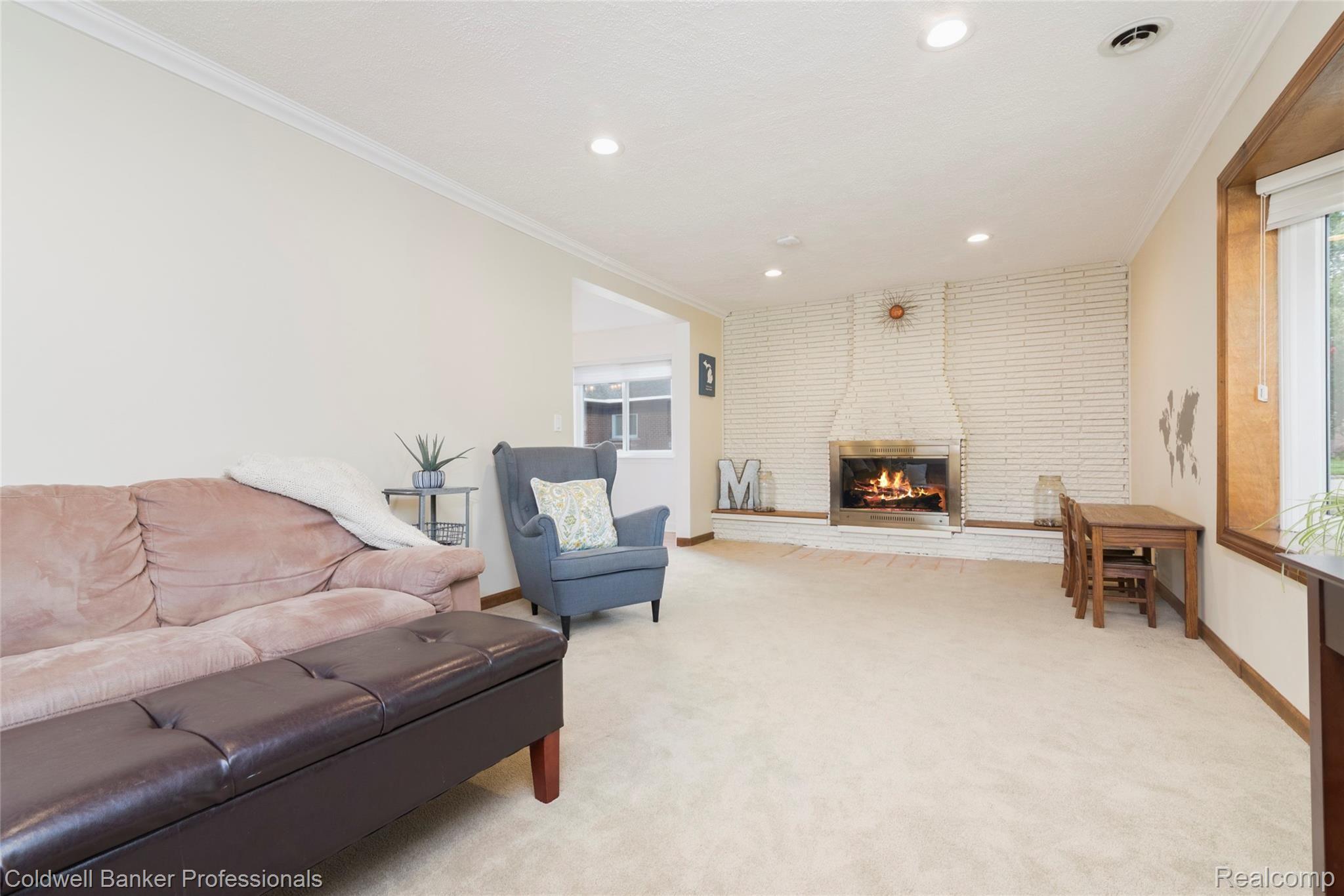 Living Room with a Full Wall Brick Fireplace