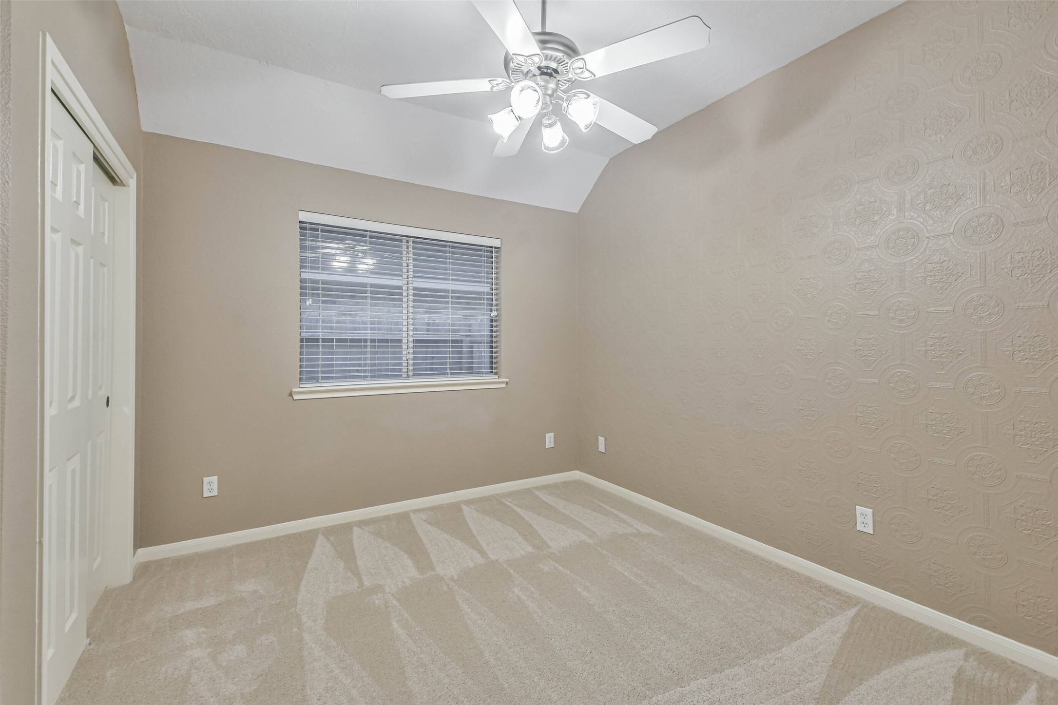 20942 Wind Field Lane Spring, TX 77379 - Photo 38 of 46 an empty room with windows and fan
