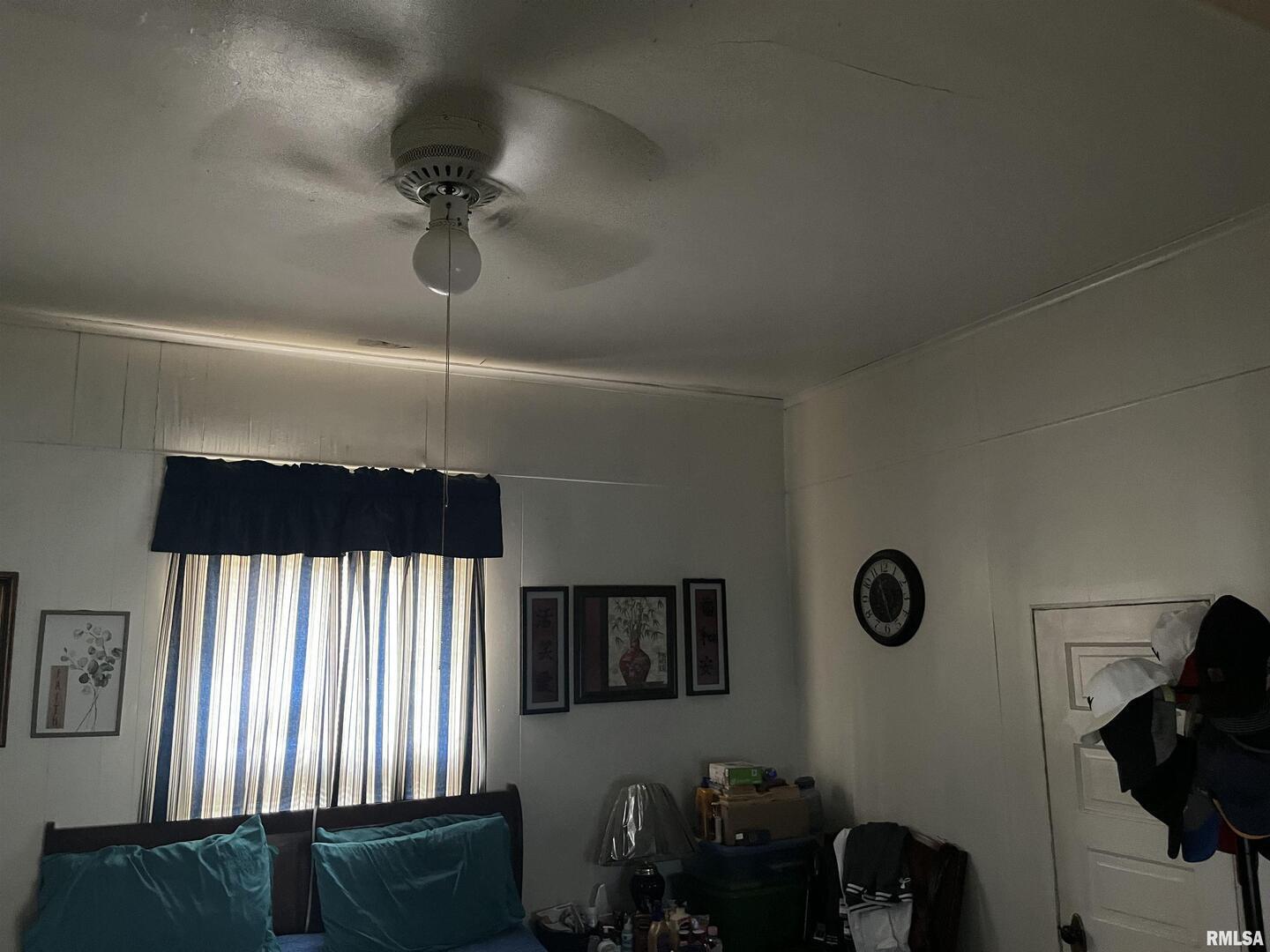 404 North Beech Street Centralia, IL 62801 - Photo 6 of 13 a bedroom with a bed and a window