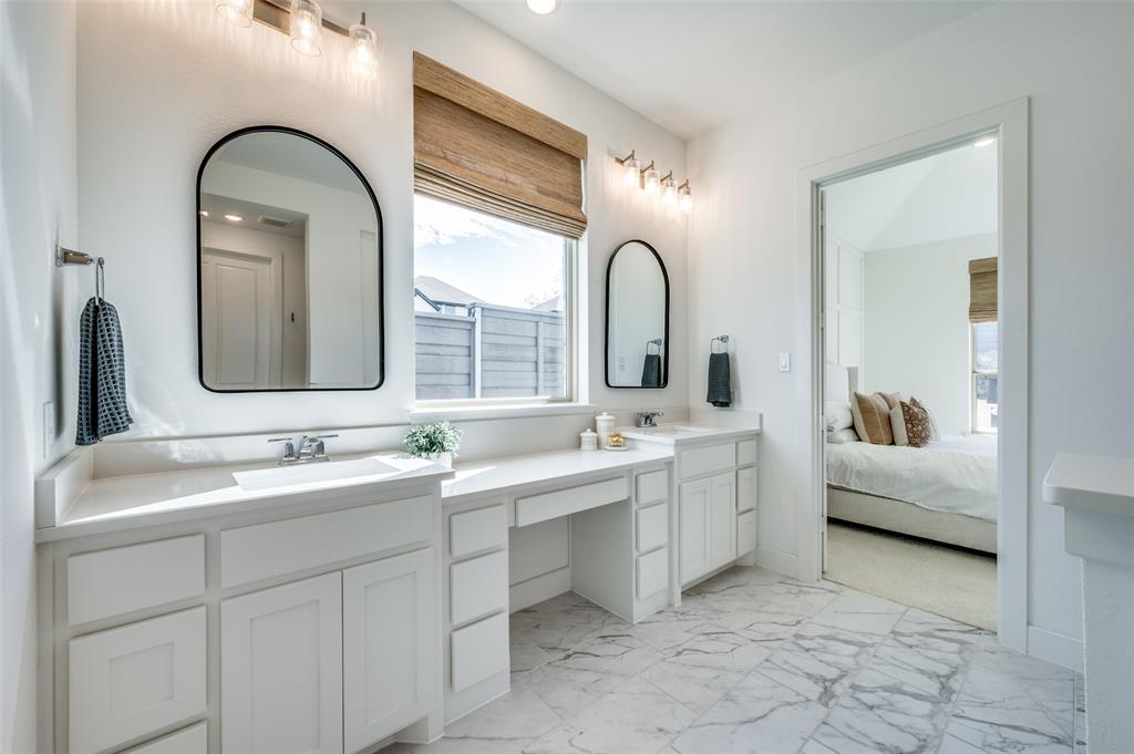 440 Sounding Street Aubrey, TX 76227 - Photo 14 of 40 a bathroom with a double vanity sink and mirror