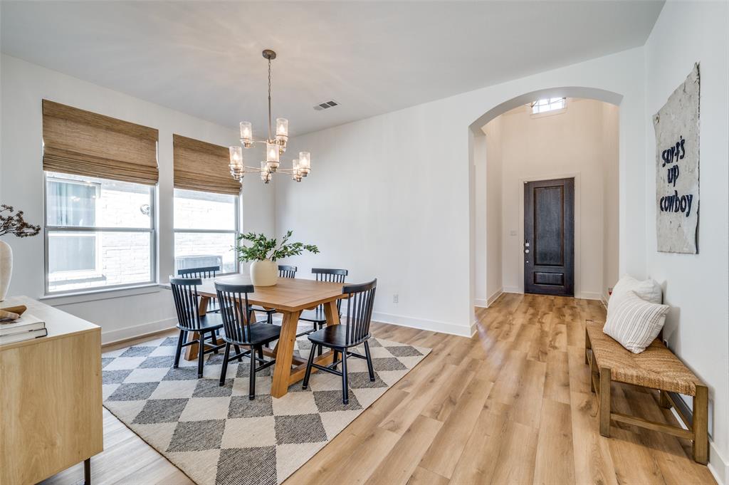 440 Sounding Street Aubrey, TX 76227 - Photo 17 of 40 a view of a dining room with furniture and window