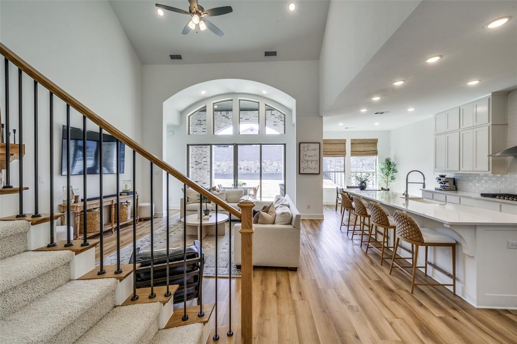 440 Sounding Street Aubrey, TX 76227 - Photo 23 of 40 a view of entryway and kitchen with wooden floor